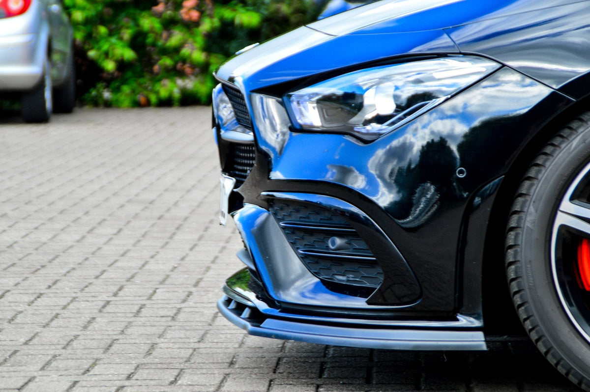Schwarze ABS Spoilerlippe für Mercedes CLA AMG-Line C118, Ingo Noak Tuning, zeigt die sportliche Fahrzeugfront.